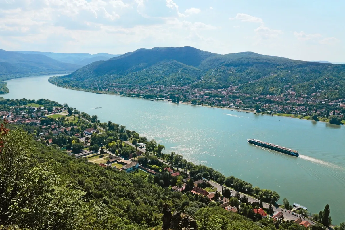 Aerial view of a cruise ship sailing on the Danube river