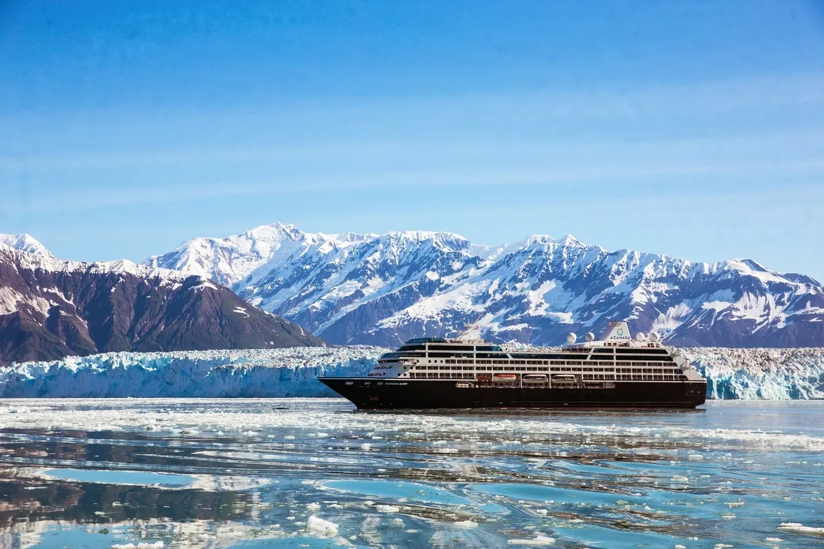 Cruise ship sailing next to glaciers in Alaska
