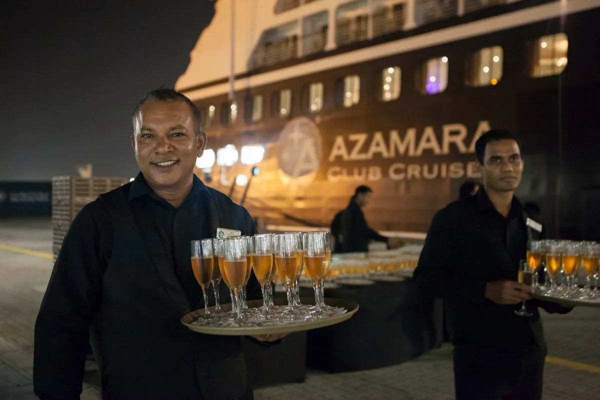 Azamara Cruises crew serving champagne