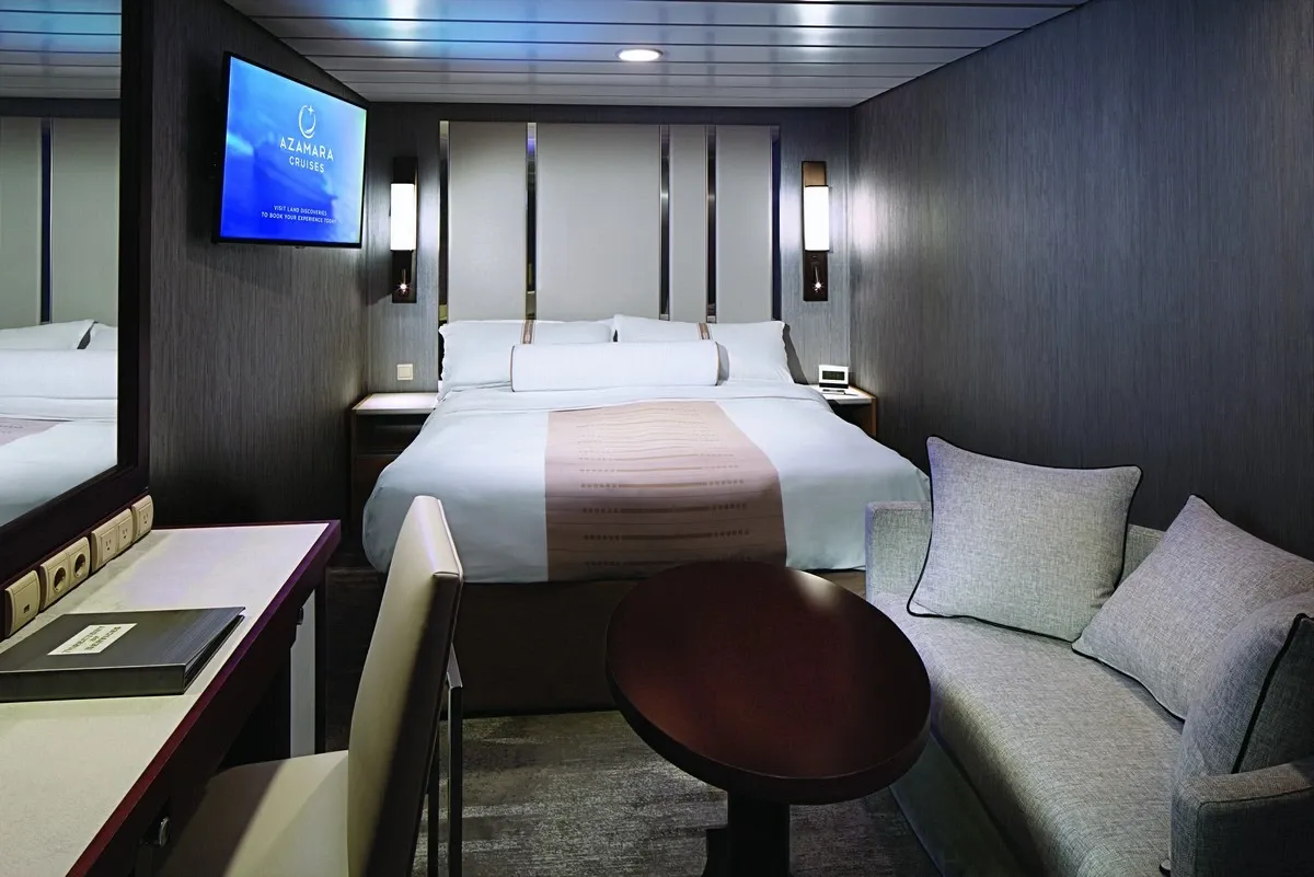 Picture of a interior suite with no windows and a queen bed