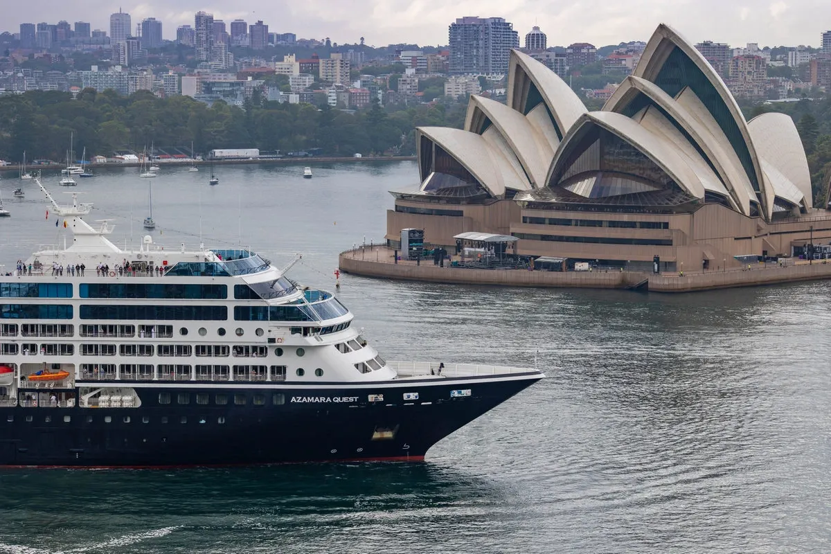 Cruise ship sailing next to the House of Opera in Sydney