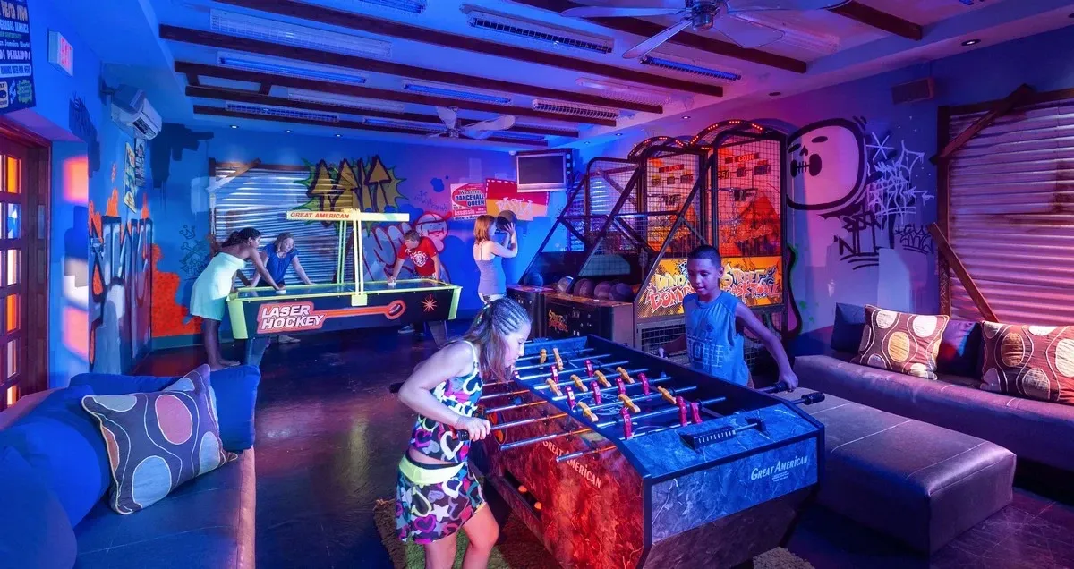 People playing at an arcade and play room