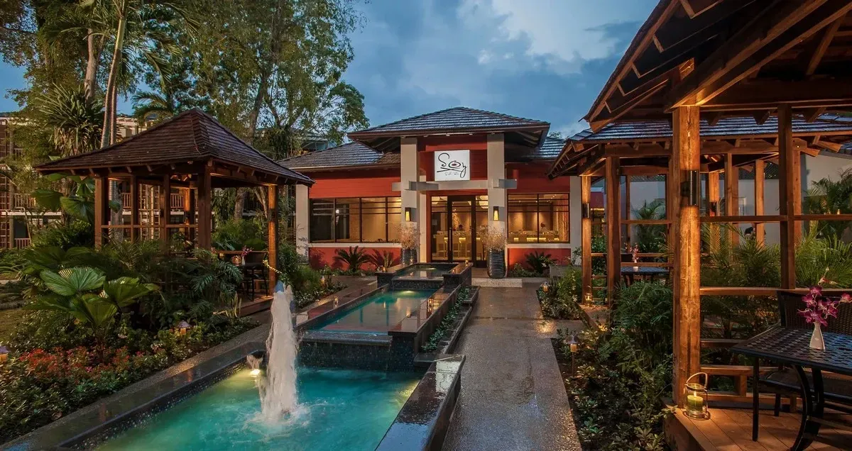 Restaurant patio with a fountain an tables