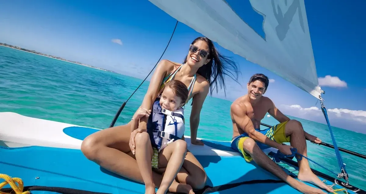 Family having fun on a sailboat