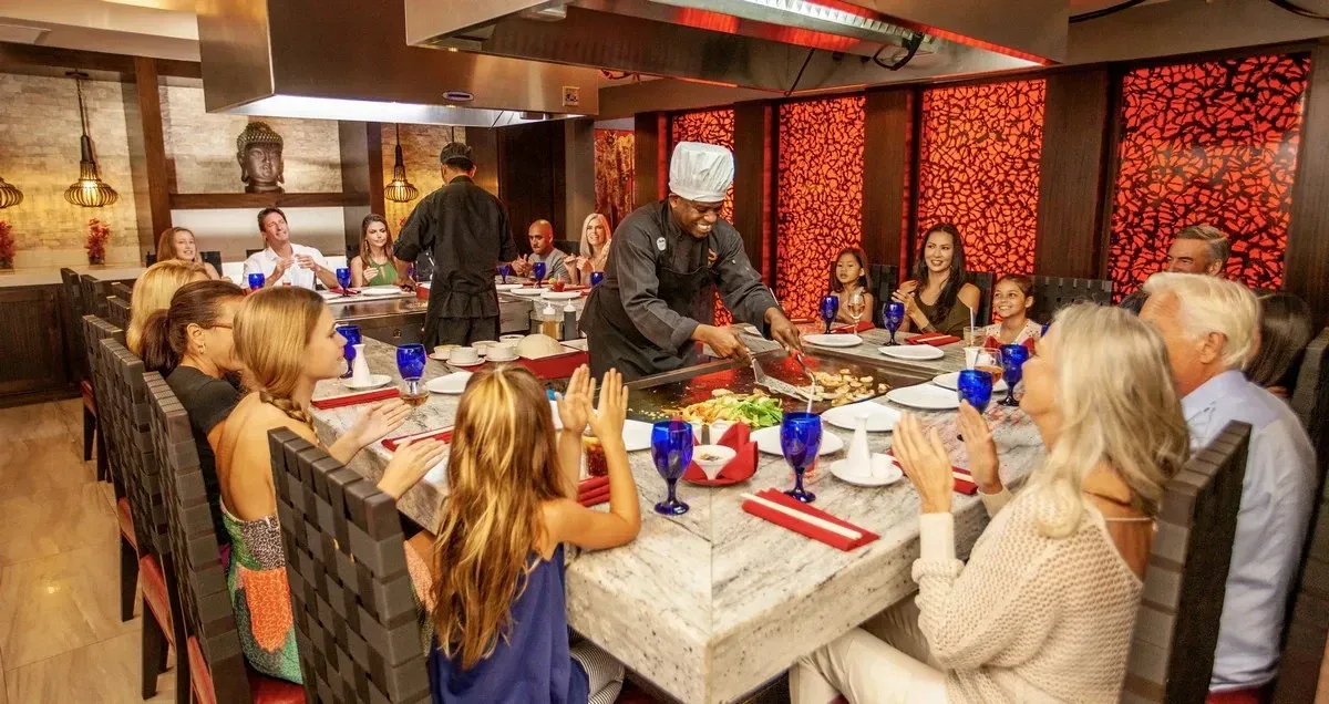 Group of people having dinner at a grill bar
