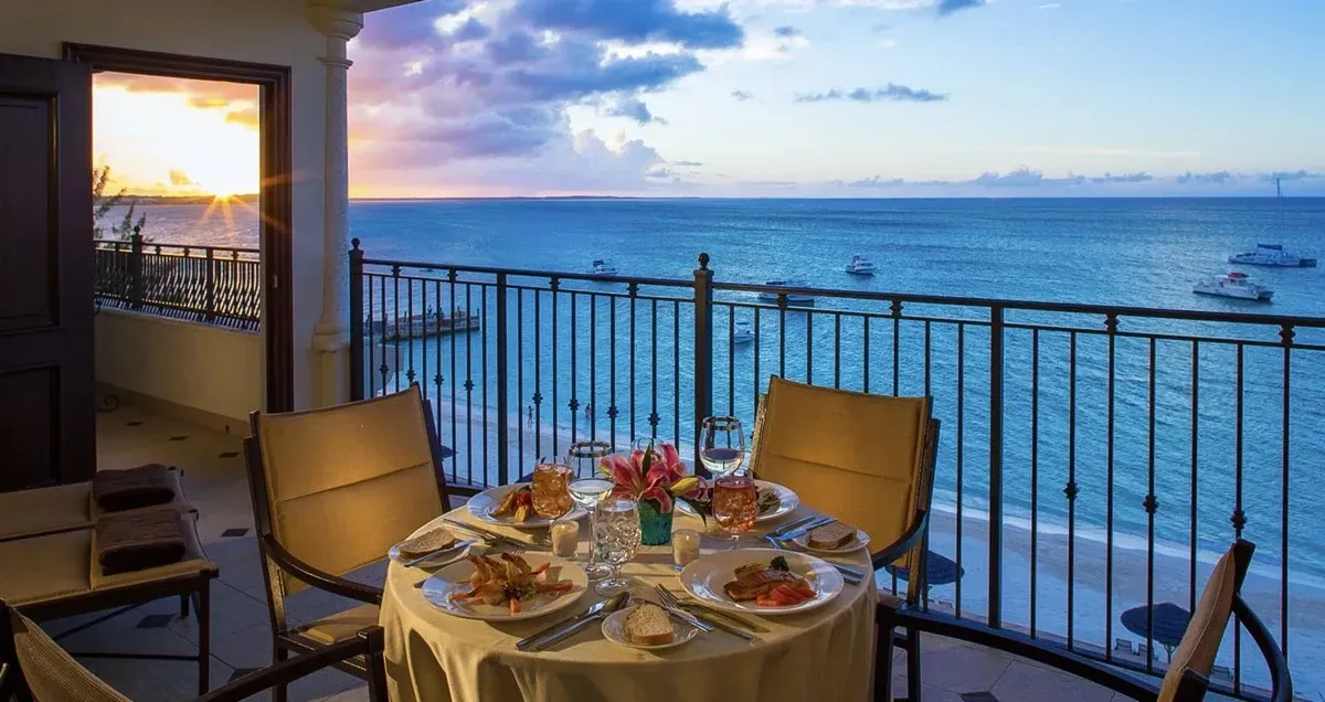 Dinning table at a balcony with ocean views