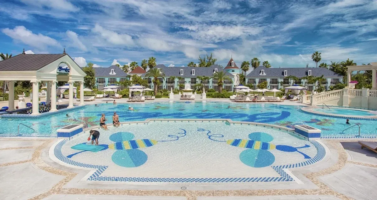 Beaches main pool with a village in the background