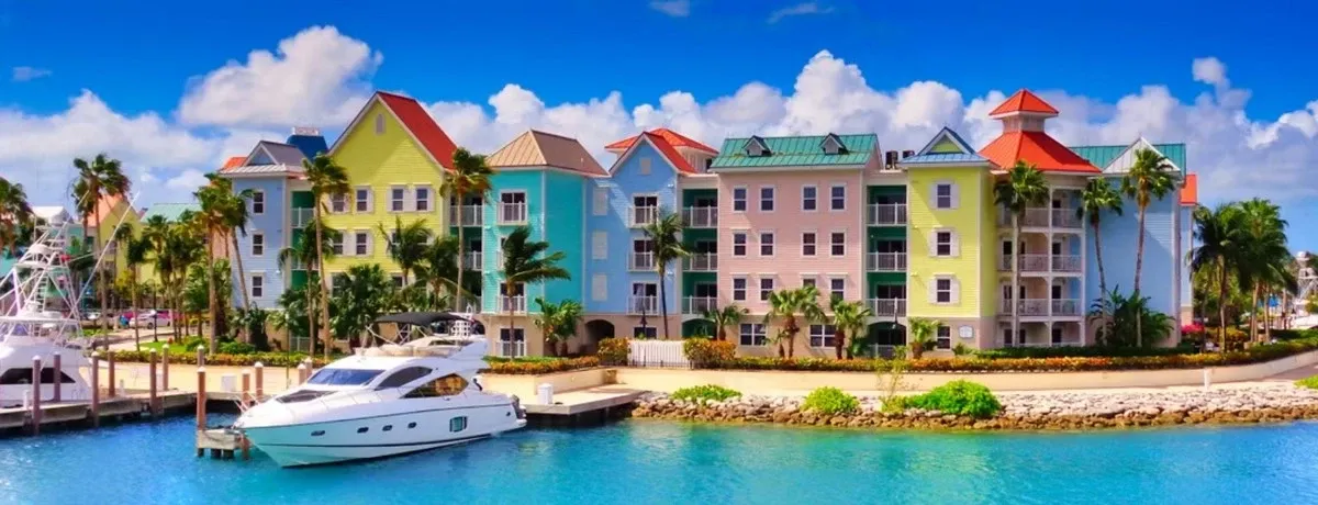 Bahamas coastline buildings and a jacht on the pier