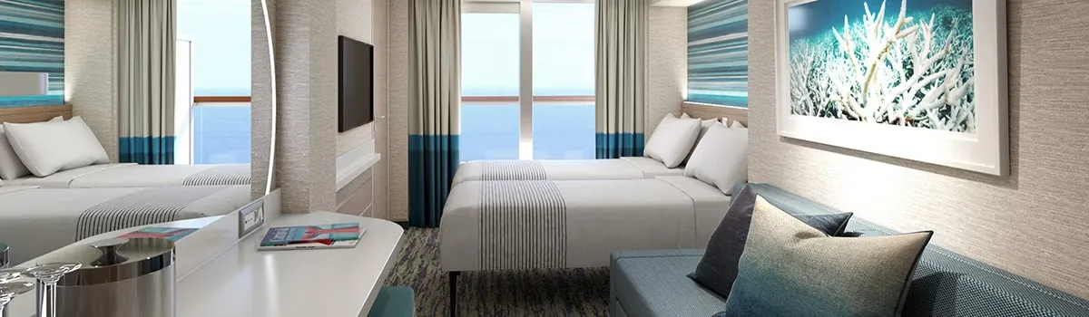 Queen bed next to a window with ocean views