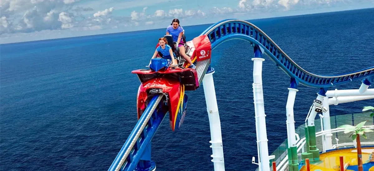 Two girls on a rollercoaster on the top deck of a cruise ship