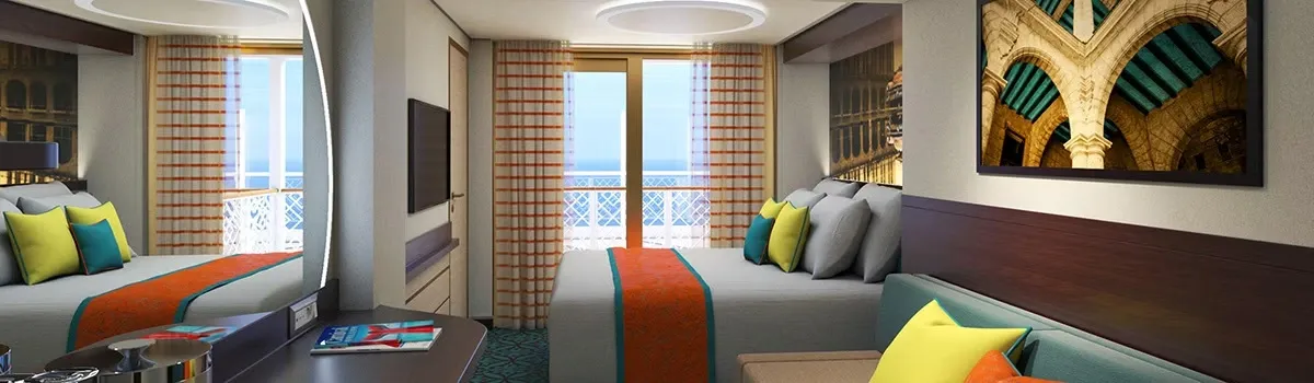 Queen bed next to a window with ocean views
