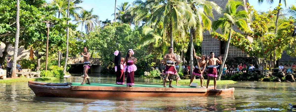 People on a canoe making a traditional dance