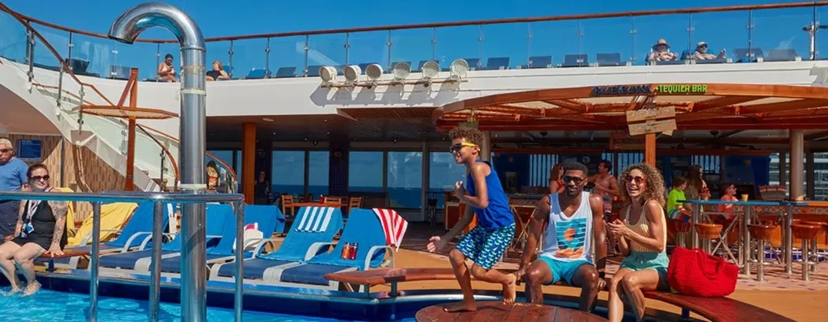 People enjoying the deck pool on a cruise ship
