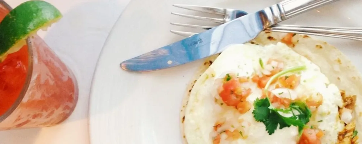 Detail view of a seafood plate on a white tablecloth