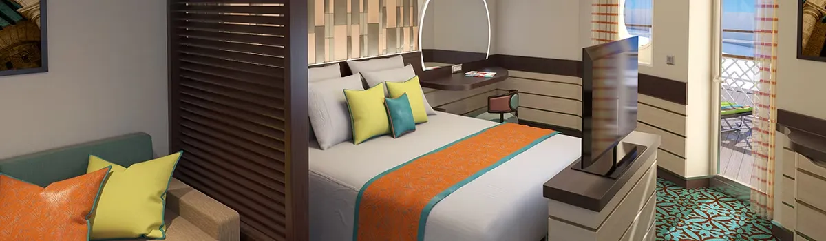 Cruise ship room with a queen bed, a television and a window to go to the balcony