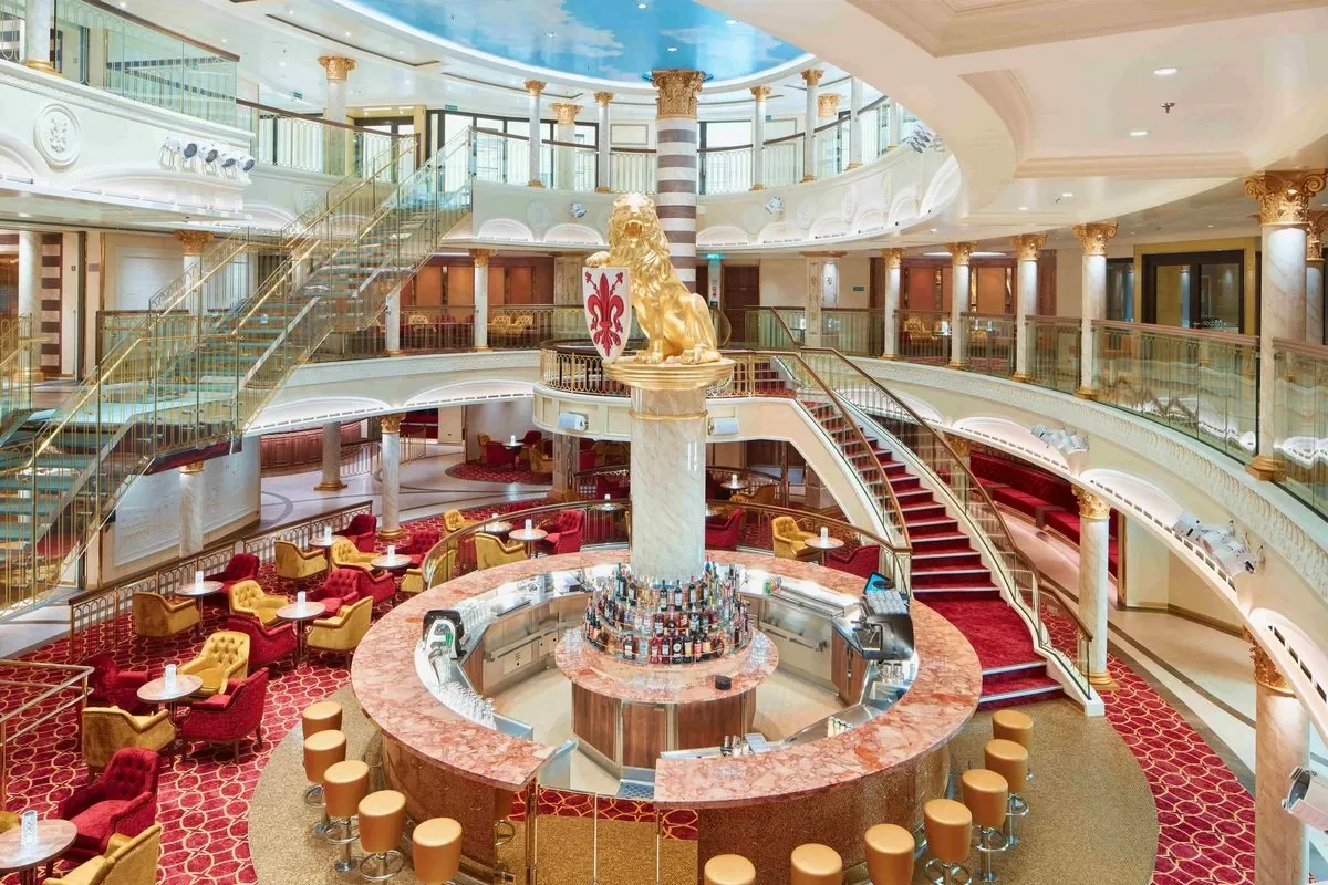 Panoramic view of a dining room and bar inside a cruise ship