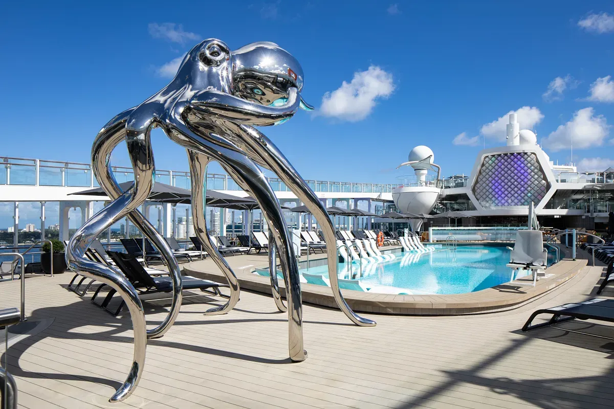 Chrome octopus statue next to a pool
