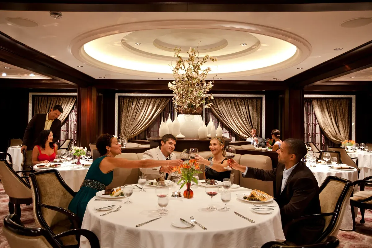 People having dinner and making a toast