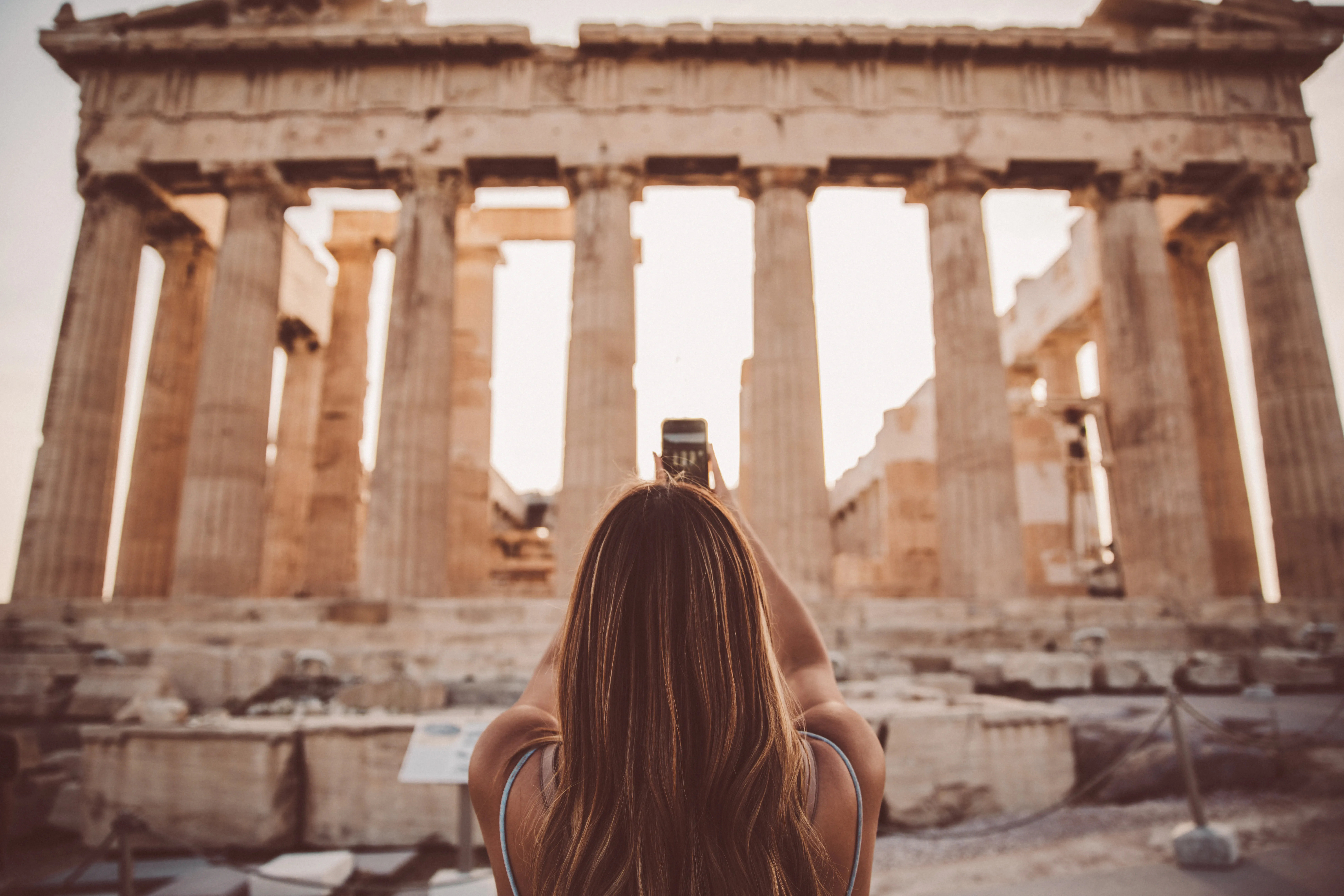 Woman standing in front of the Partenon in Greece