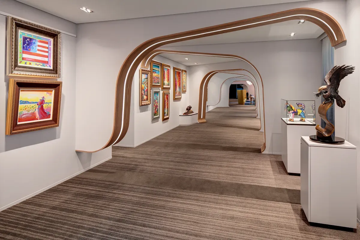 Art gallery with statues and paintings on the wall