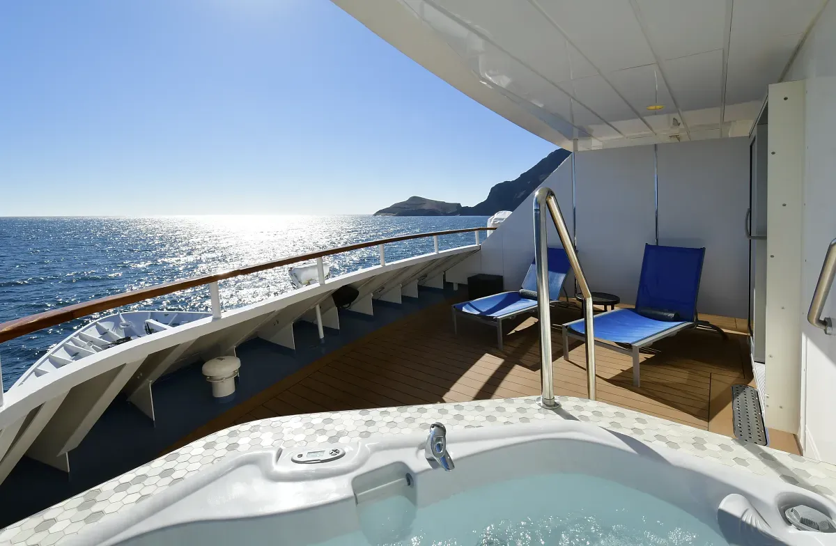 Lounge sundeck with a jacuzzi and views to the ocean