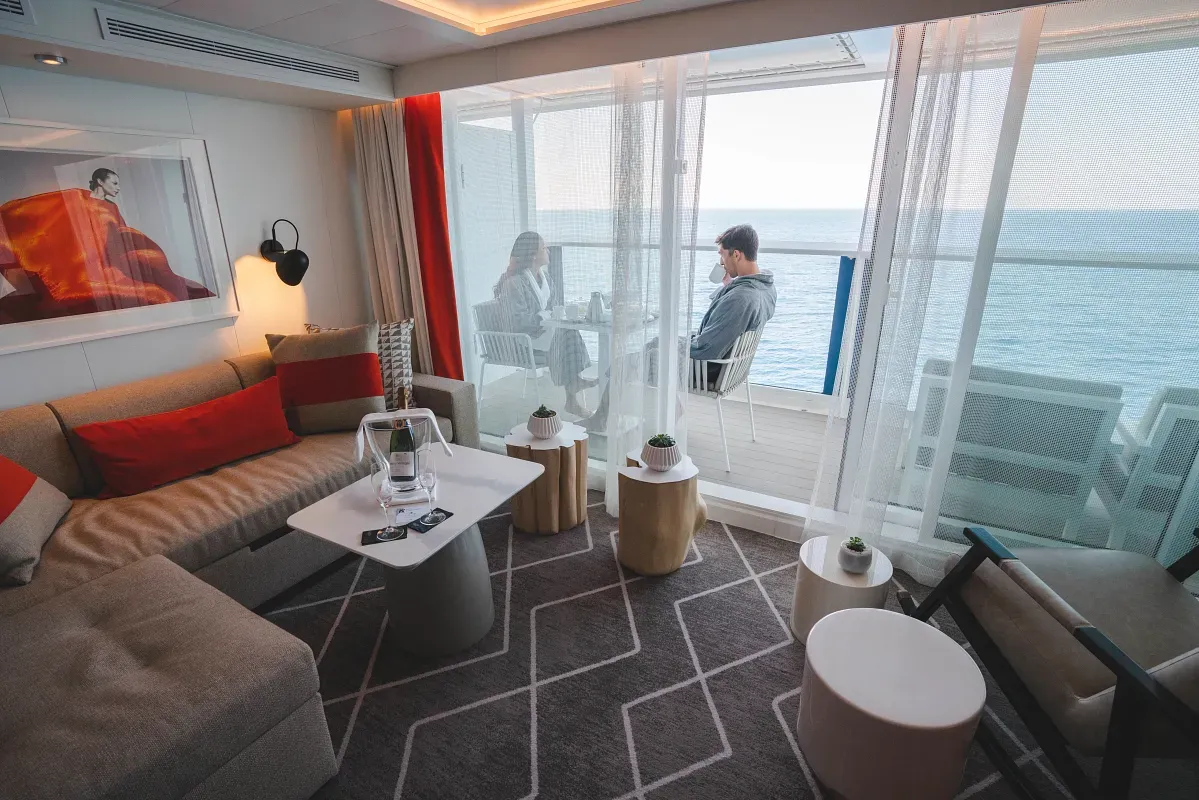Living space and balcony on a cruise ship suite