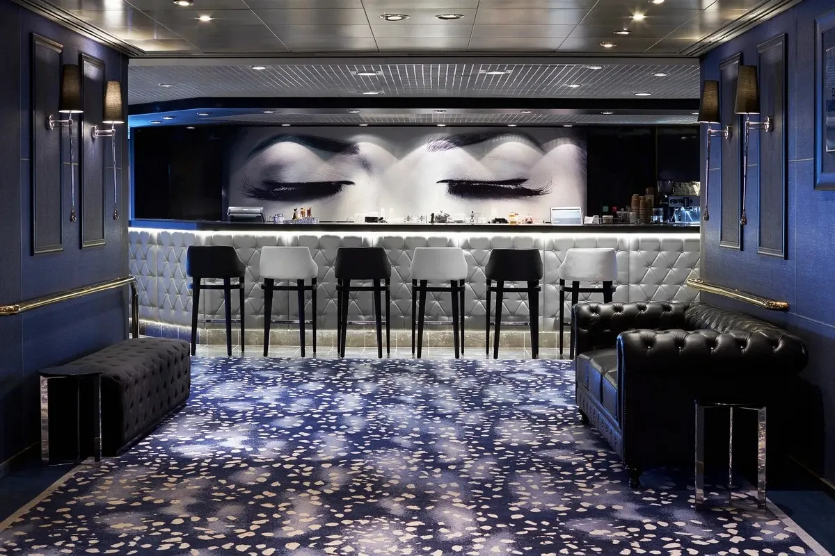 Panoramic view of a bar with dark decorations