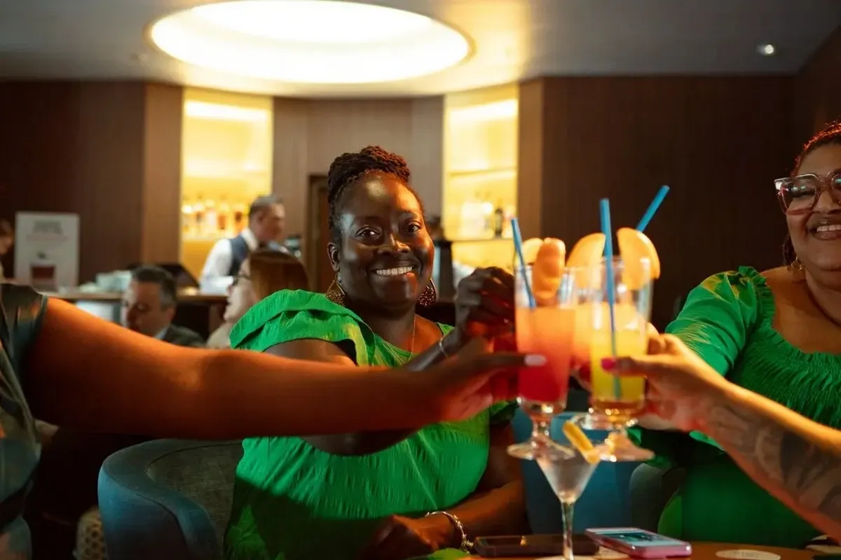 Group of people having a toast at a bar
