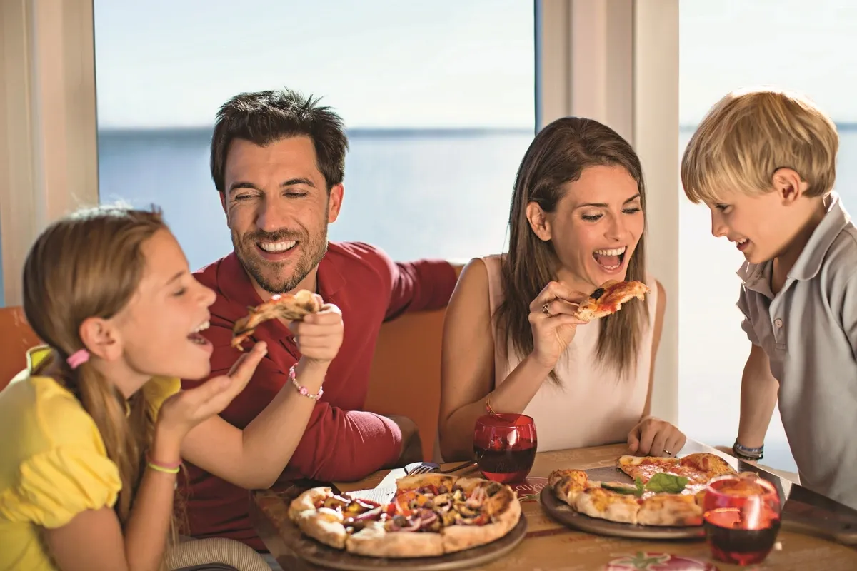 Happy family eating pizza