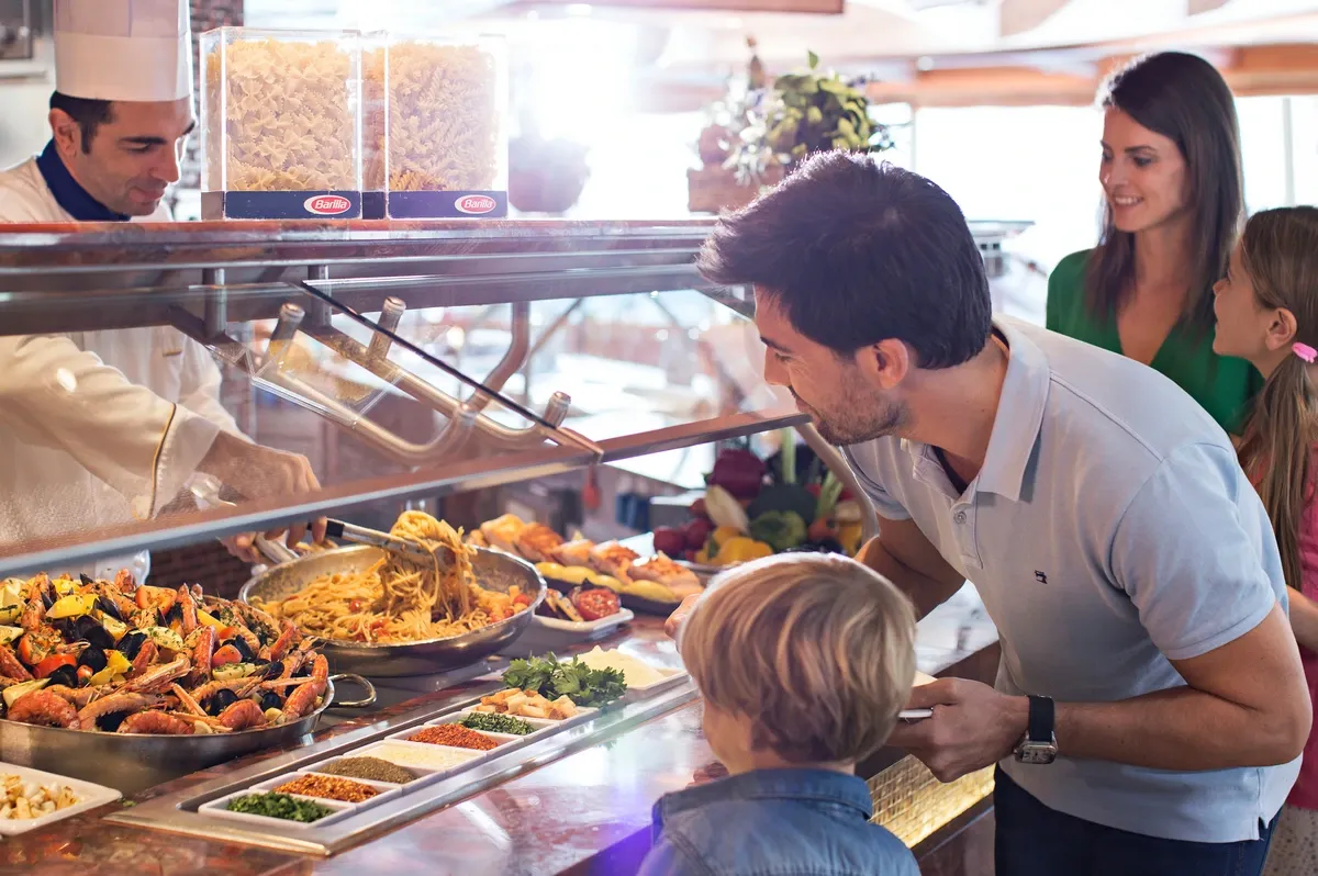 Family looking at food at a buffet