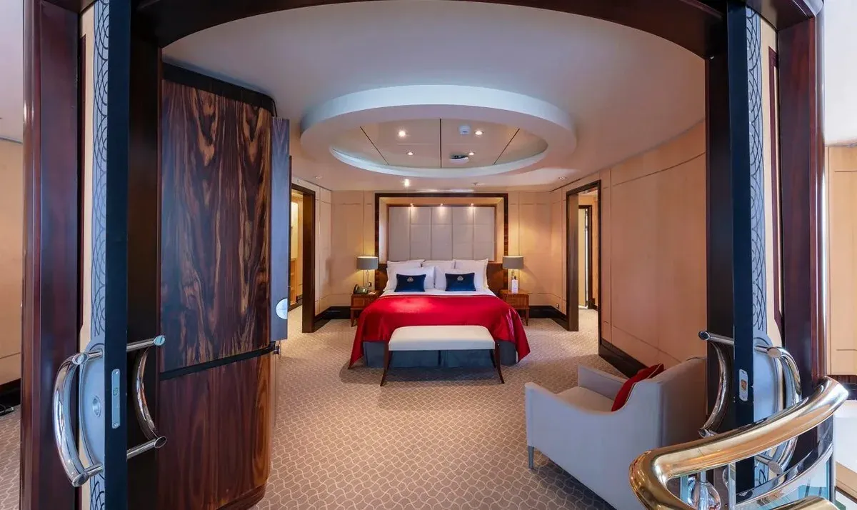 Cruise ship stateroom with a large bed