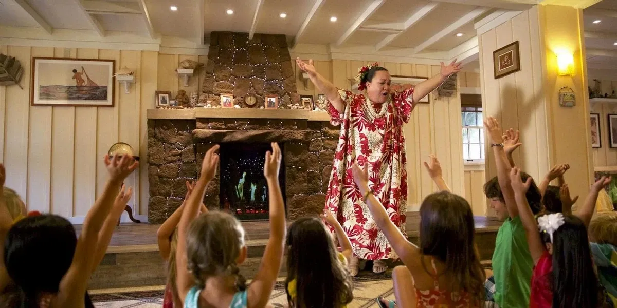 A woman entertaining a group of kids