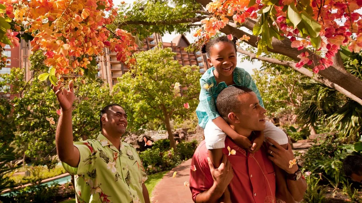 Family hanging out at the resort garden
