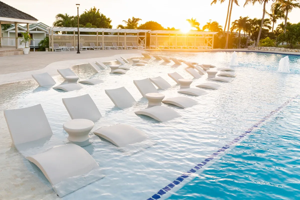 Resort pool with sunbeds at the sundown