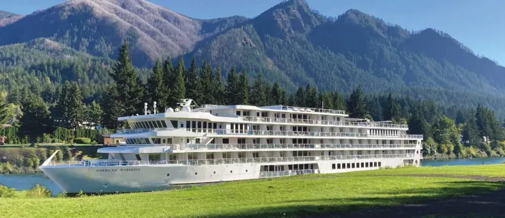 American Harmony cruise ship on a mountain scenery