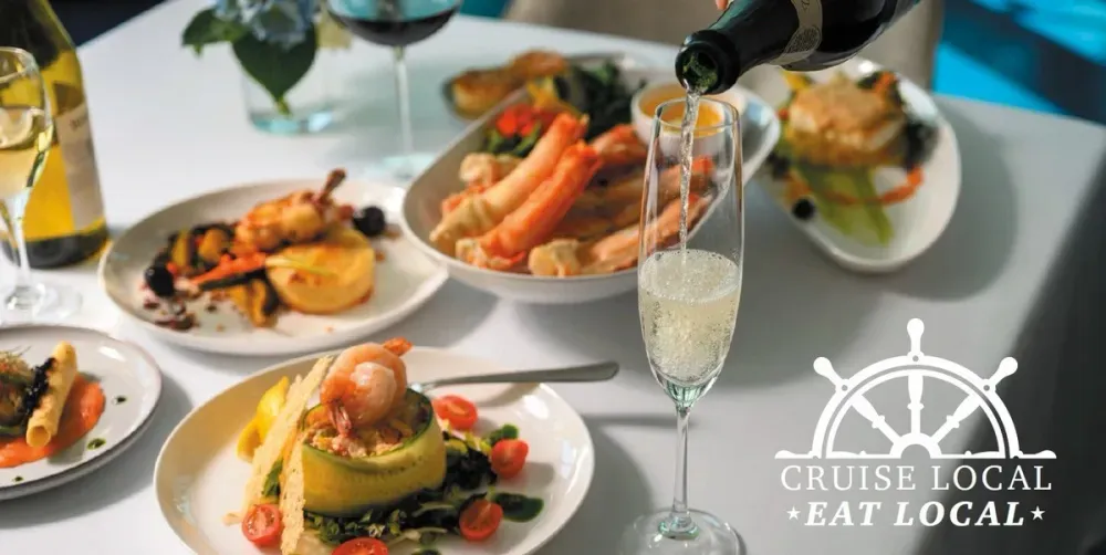 Fancy dinner with seafood, veggies and champagne