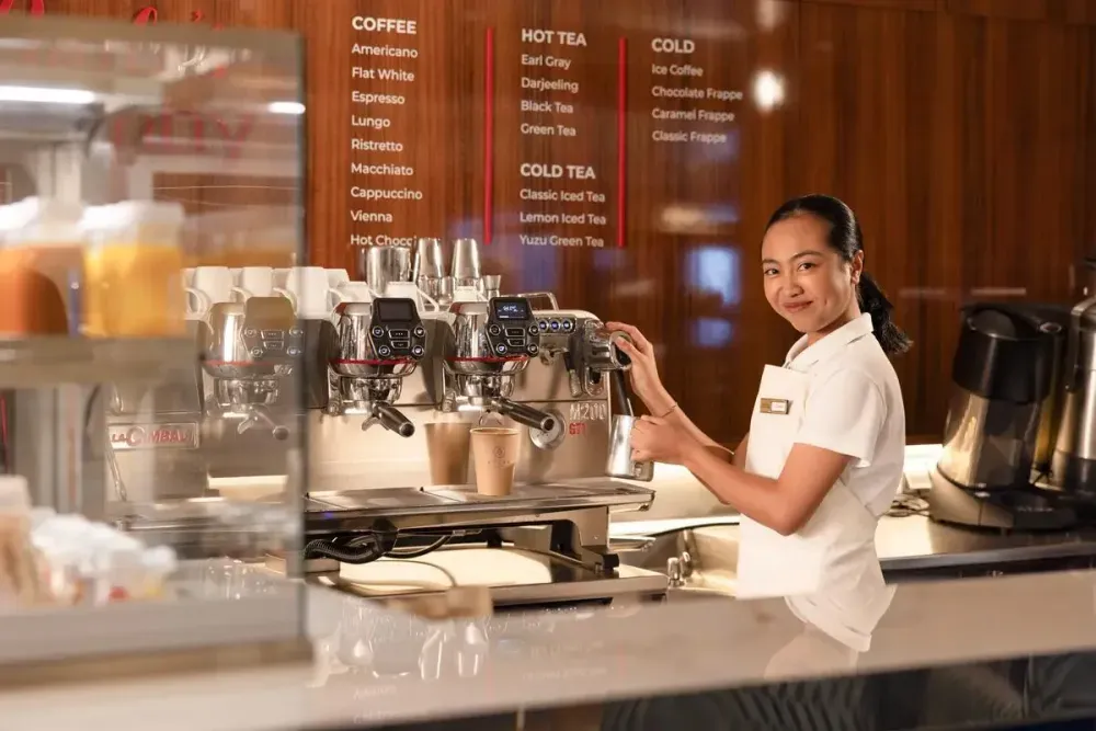 Barista making a coffee on the ship's cafeteria